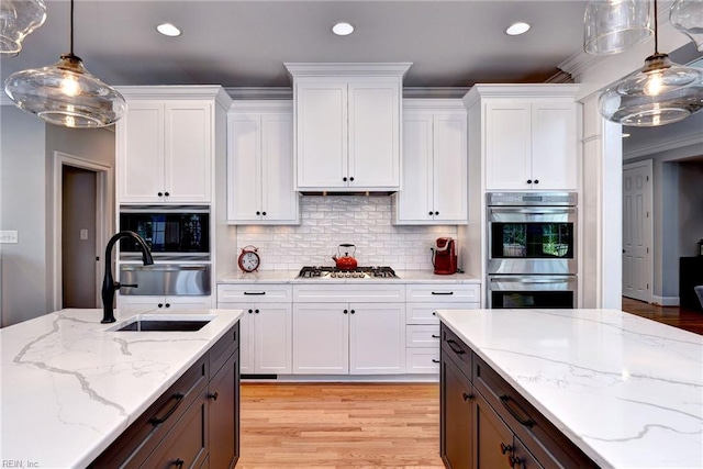 1808 John Hancock Rd, Williamsburg, VA 23185 - kitchen with white cabinets, double oven, gas stovetop, black microwave, and recessed lighting