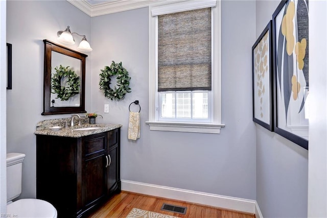1808 John Hancock Rd, Williamsburg, VA 23185 - half bath with wood finished floors, vanity, and ornamental molding