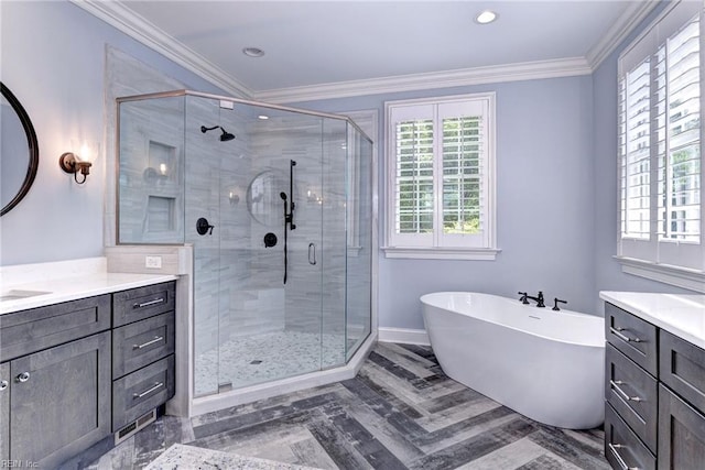 1808 John Hancock Rd, Williamsburg, VA 23185 - full bath featuring vanity, a freestanding tub, a shower stall, ornamental molding, and recessed lighting