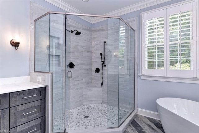 1808 John Hancock Rd, Williamsburg, VA 23185 - bathroom with a freestanding bath, a stall shower, ornamental molding, and vanity