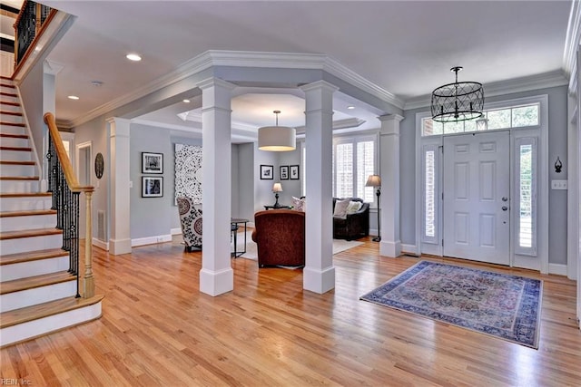 1808 John Hancock Rd, Williamsburg, VA 23185 - foyer entrance featuring decorative columns, light wood finished floors, stairway, recessed lighting, and crown molding