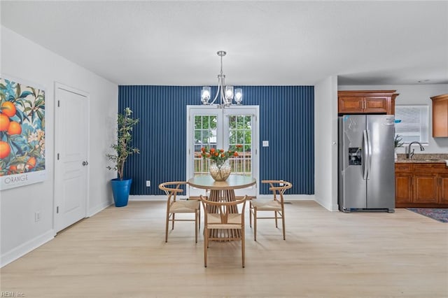 3520 S Warwick Cir, Norfolk, VA 23513 - dining area with light wood finished floors and a chandelier