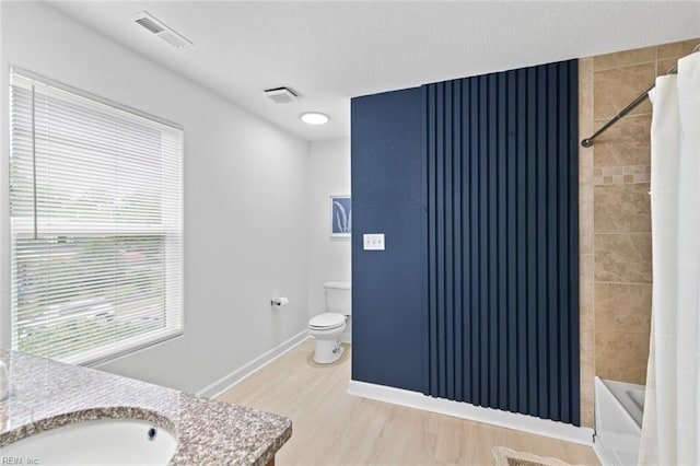 3520 S Warwick Cir, Norfolk, VA 23513 - full bath with vanity, wood finished floors, and shower / bathtub combination with curtain