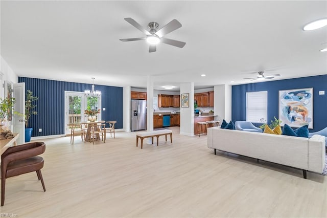 3520 S Warwick Cir, Norfolk, VA 23513 - living room featuring ceiling fan, a chandelier, and light wood-style floors