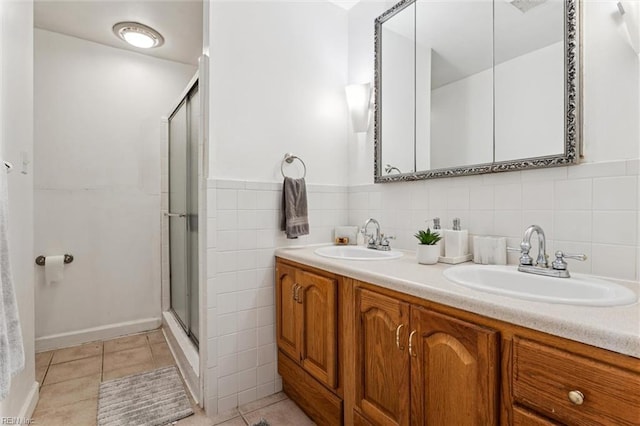 1408 Planting Ct, Virginia Beach, VA 23453 - full bathroom featuring a stall shower, double vanity, tile walls, and tile patterned flooring