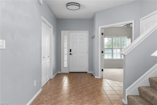 1028 Cathedral Dr, Suffolk, VA 23434 - tiled foyer with stairway and baseboards