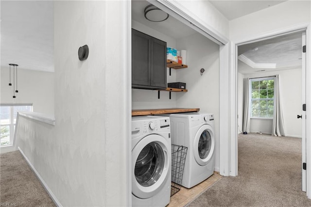 1028 Cathedral Dr, Suffolk, VA 23434 - washroom featuring separate washer and dryer, light carpet, and cabinet space