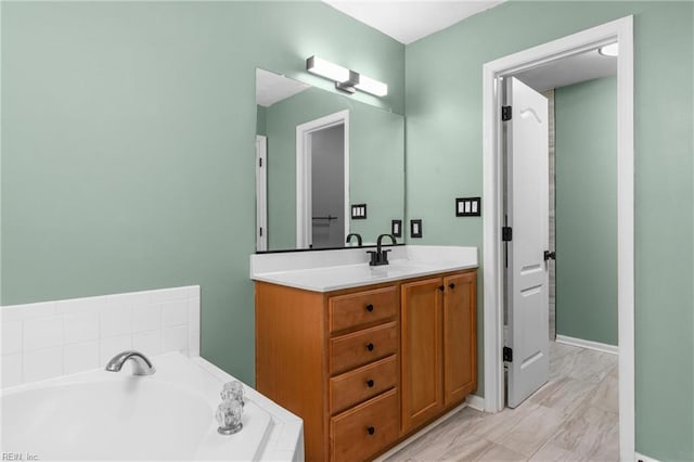 1028 Cathedral Dr, Suffolk, VA 23434 - bathroom with vanity, a bath, and marble finish flooring