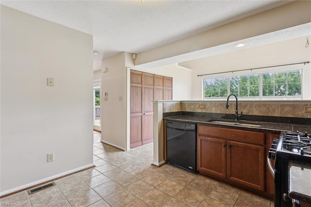 208 Sherbrooke Dr, Newport News, VA 23602 - kitchen with dishwasher, plenty of natural light, brown cabinetry, range with gas cooktop, and a textured ceiling