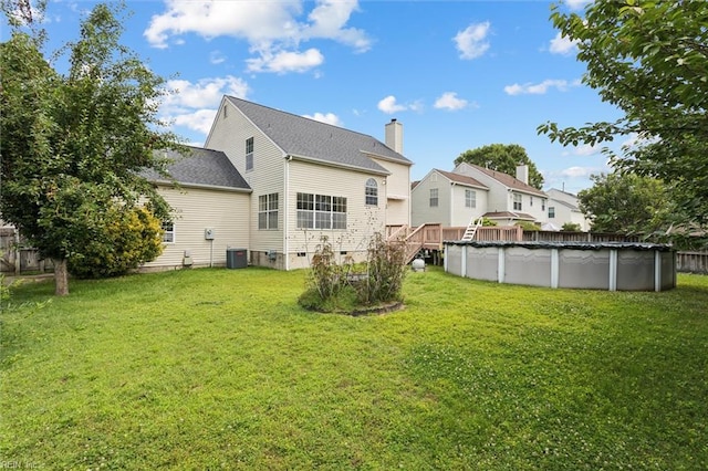 208 Sherbrooke Dr, Newport News, VA 23602 - rear view of property featuring a yard, a covered pool, and a chimney