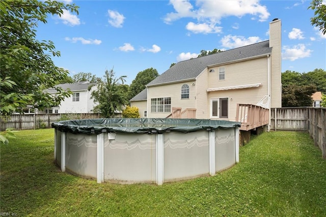 208 Sherbrooke Dr, Newport News, VA 23602 - back of house with a chimney, a fenced backyard, and a wooden deck