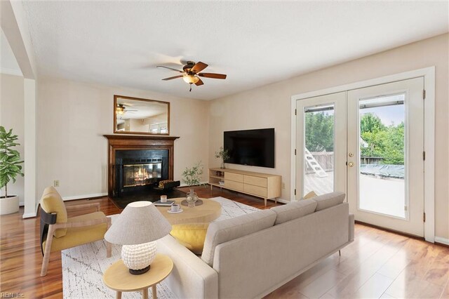 208 Sherbrooke Dr, Newport News, VA 23602 - living room featuring wood finished floors, french doors, a glass covered fireplace, and ceiling fan