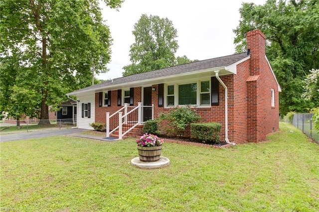 194 Railroad St, Williamsburg, VA 23185 - single story home with a chimney, brick siding, and asphalt driveway