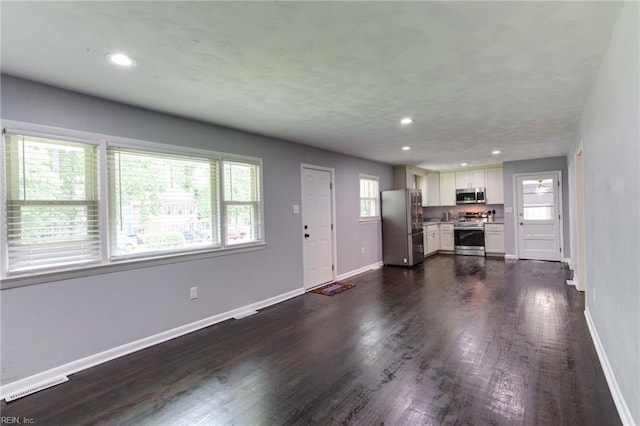 194 Railroad St, Williamsburg, VA 23185 - unfurnished living room with dark wood-style floors and recessed lighting
