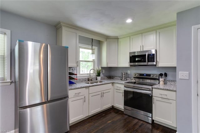 194 Railroad St, Williamsburg, VA 23185 - kitchen with stainless steel appliances, dark wood-type flooring, light stone countertops, and white cabinetry