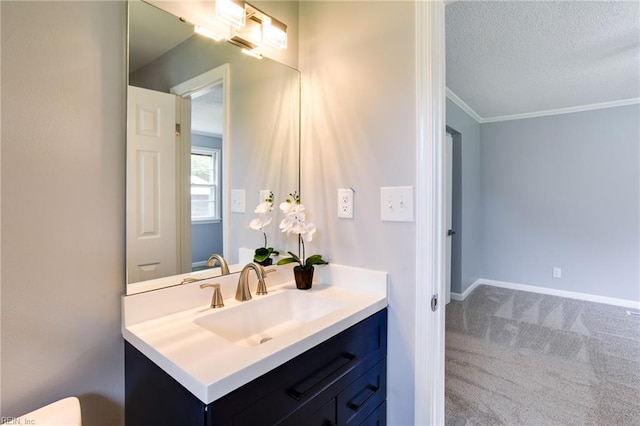 194 Railroad St, Williamsburg, VA 23185 - bathroom featuring vanity, ornamental molding, and a textured ceiling