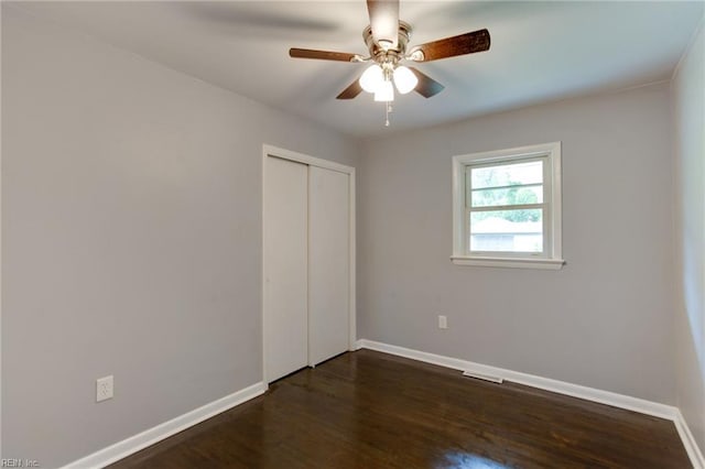 194 Railroad St, Williamsburg, VA 23185 - unfurnished bedroom with dark wood-style floors, a closet, and ceiling fan