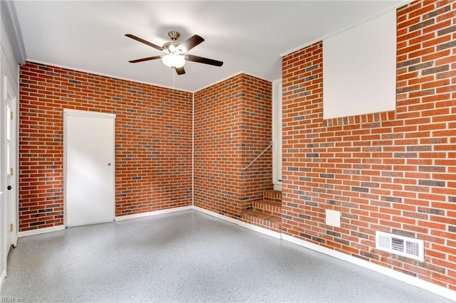 194 Railroad St, Williamsburg, VA 23185 - unfurnished room with ceiling fan, brick wall, and speckled floor