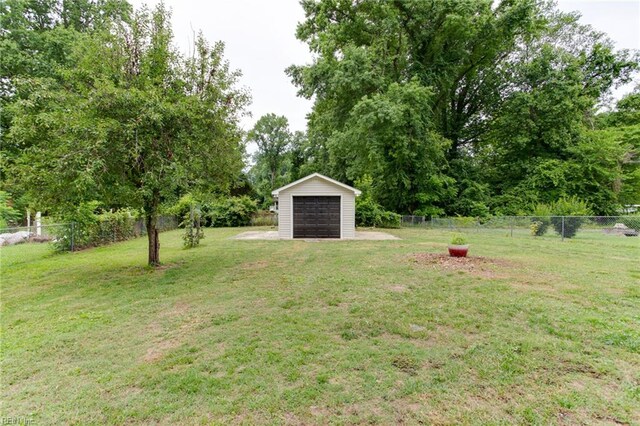 194 Railroad St, Williamsburg, VA 23185 - view of yard featuring an outdoor structure and a detached garage