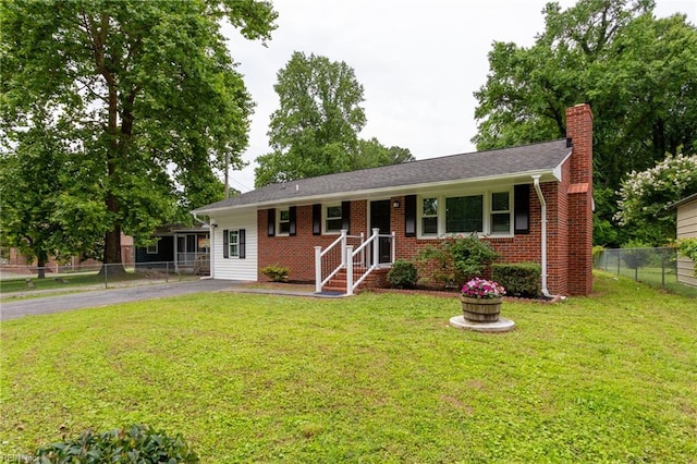 194 Railroad St, Williamsburg, VA 23185 - ranch-style home with asphalt driveway, a chimney, and brick siding