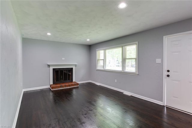 194 Railroad St, Williamsburg, VA 23185 - unfurnished living room featuring a fireplace, dark wood-type flooring, and recessed lighting