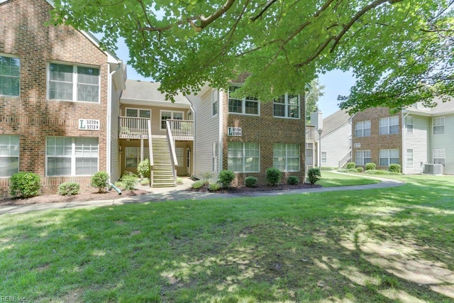 5225 Thatcher Way, Virginia Beach, VA 23456 - townhome / multi-family property with stairs, a front yard, and brick siding
