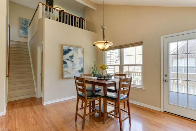 5225 Thatcher Way, Virginia Beach, VA 23456 - dining space with light wood-style flooring, stairs, and high vaulted ceiling