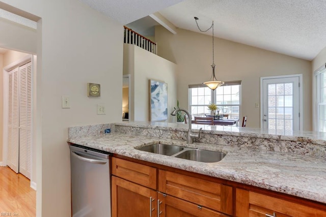 5225 Thatcher Way, Virginia Beach, VA 23456 - kitchen featuring dishwasher, vaulted ceiling, brown cabinetry, light stone countertops, and pendant lighting