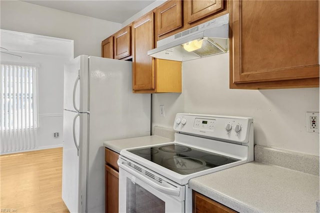 48 Terri Sue Ct, Hampton, VA 23666 - kitchen featuring under cabinet range hood, white electric range oven, brown cabinetry, light countertops, and light wood-style floors