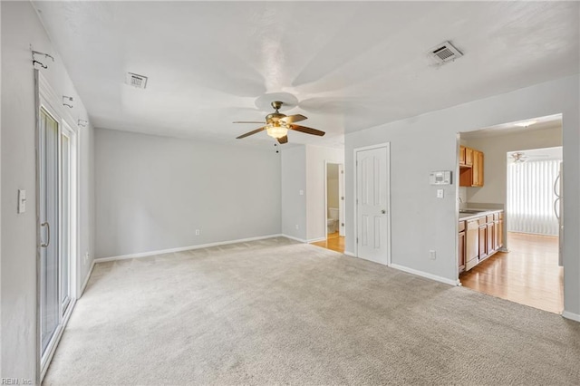 48 Terri Sue Ct, Hampton, VA 23666 - unfurnished living room featuring light colored carpet and a ceiling fan