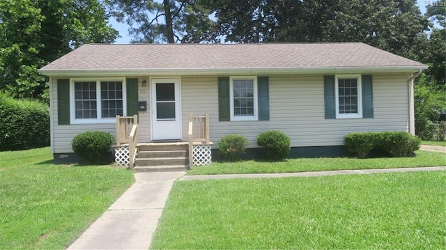 711 Mclawhorne Dr, Newport News, VA 23605 - view of front of house with a front yard and roof with shingles