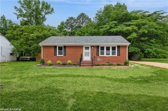 105 Fairfield Ave, Suffolk, VA 23434 - single story home with a front yard, brick siding, roof with shingles, and dirt driveway