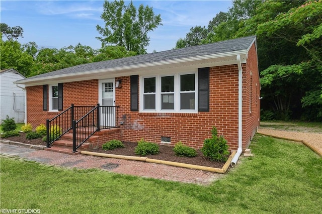 105 Fairfield Ave, Suffolk, VA 23434 - view of front of property featuring a front yard, brick siding, and a shingled roof