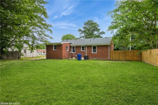 105 Fairfield Ave, Suffolk, VA 23434 - rear view of house featuring a fenced backyard and brick siding