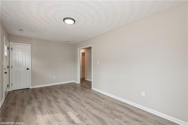 105 Fairfield Ave, Suffolk, VA 23434 - empty room featuring wood finished floors and a textured ceiling