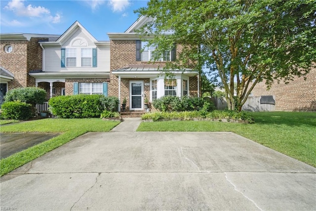 512 S Lake Cir, Chesapeake, VA 23322 - view of front of home featuring brick siding and a front lawn