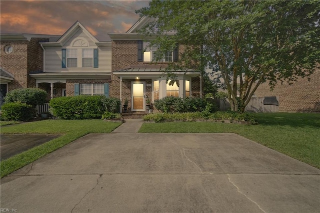 512 S Lake Cir, Chesapeake, VA 23322 - view of front of property featuring brick siding and a front lawn