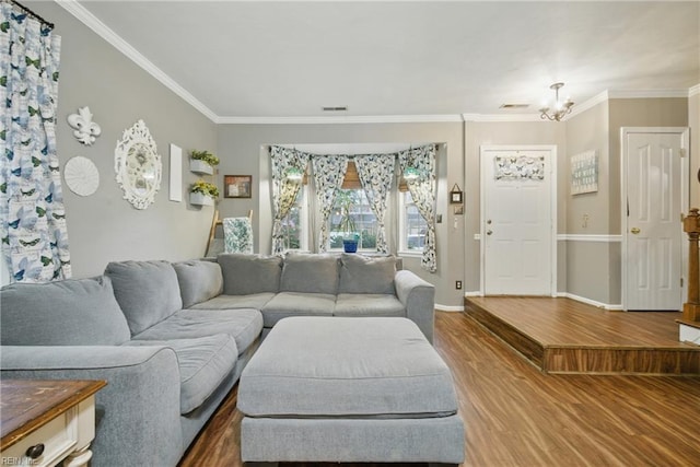 512 S Lake Cir, Chesapeake, VA 23322 - living room featuring wood finished floors, a chandelier, and crown molding