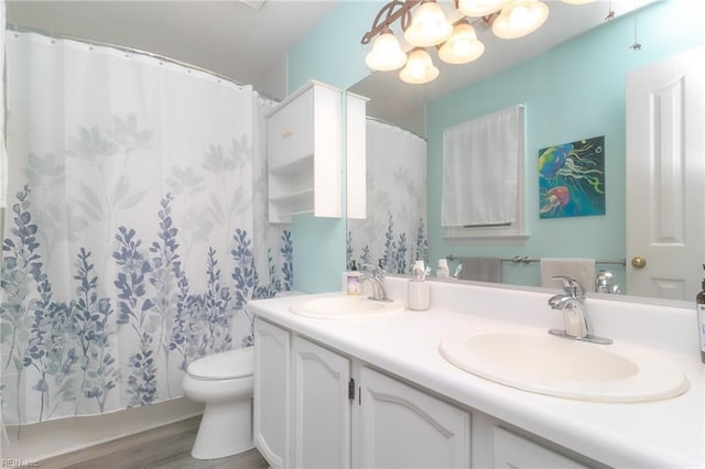 2405 Broadnax Cir, Chesapeake, VA 23323 - full bath with double vanity, wood finished floors, a chandelier, and a shower with shower curtain