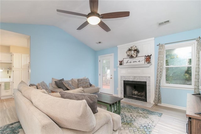 2405 Broadnax Cir, Chesapeake, VA 23323 - living area with light wood finished floors, lofted ceiling, ceiling fan, and a fireplace
