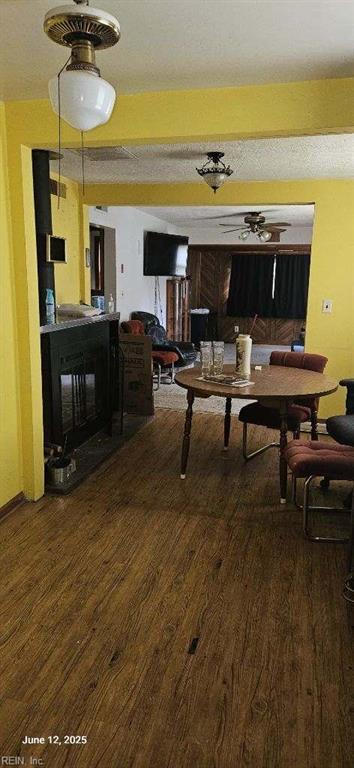 5412 E Princess Anne Rd, Norfolk, VA 23502 - dining space featuring wood finished floors and a fireplace