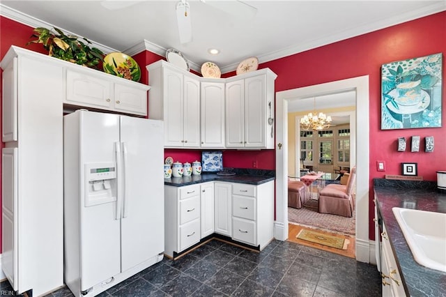 812 Stockley Gdns Unit 2, Norfolk, VA 23507 - kitchen featuring white fridge with ice dispenser, dark countertops, white cabinetry, ornamental molding, and a chandelier
