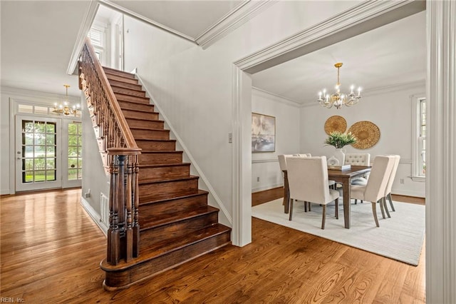 417 Peace Haven Dr, Norfolk, VA 23502 - dining room with a chandelier, stairs, wood finished floors, and ornamental molding