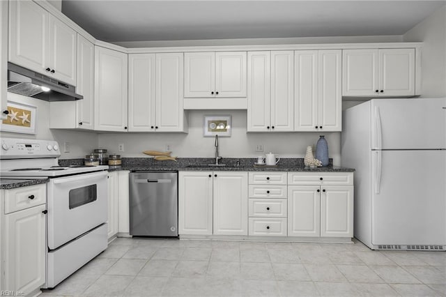 416 27th St, Virginia Beach, VA 23451 - kitchen with white appliances, under cabinet range hood, white cabinets, and dark stone counters