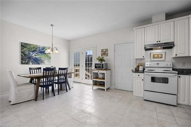 416 27th St, Virginia Beach, VA 23451 - kitchen featuring white electric range oven, under cabinet range hood, dark countertops, a chandelier, and stainless steel microwave