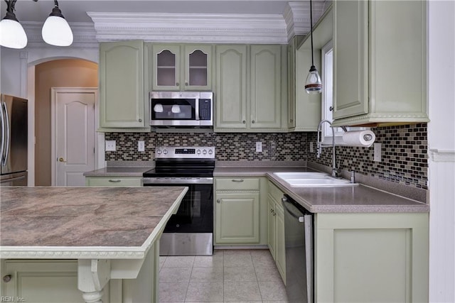 3248 Windsor Rdg, Williamsburg, VA 23188 - kitchen with appliances with stainless steel finishes, green cabinets, decorative backsplash, crown molding, and hanging light fixtures