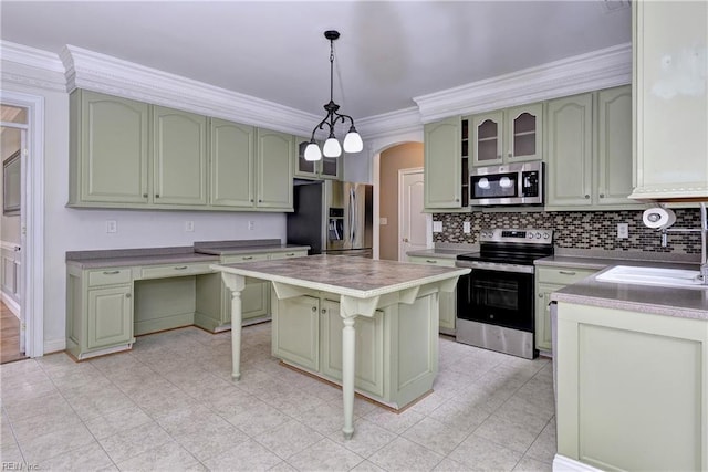 3248 Windsor Rdg, Williamsburg, VA 23188 - kitchen with stainless steel appliances, green cabinets, arched walkways, ornamental molding, and backsplash