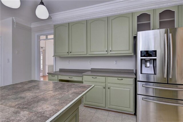 3248 Windsor Rdg, Williamsburg, VA 23188 - kitchen with stainless steel fridge, green cabinetry, dark countertops, and ornamental molding