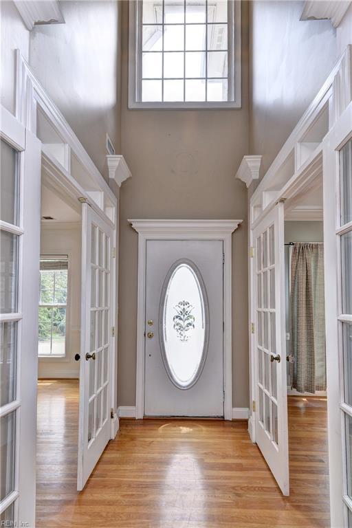 3248 Windsor Rdg, Williamsburg, VA 23188 - entryway featuring french doors, a towering ceiling, and wood finished floors