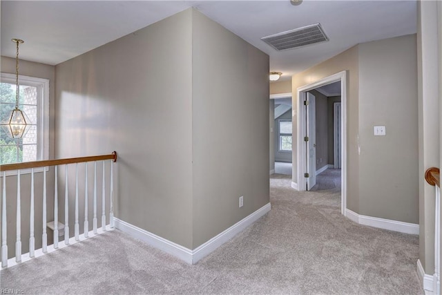 3248 Windsor Rdg, Williamsburg, VA 23188 - hallway featuring carpet floors, plenty of natural light, and an upstairs landing